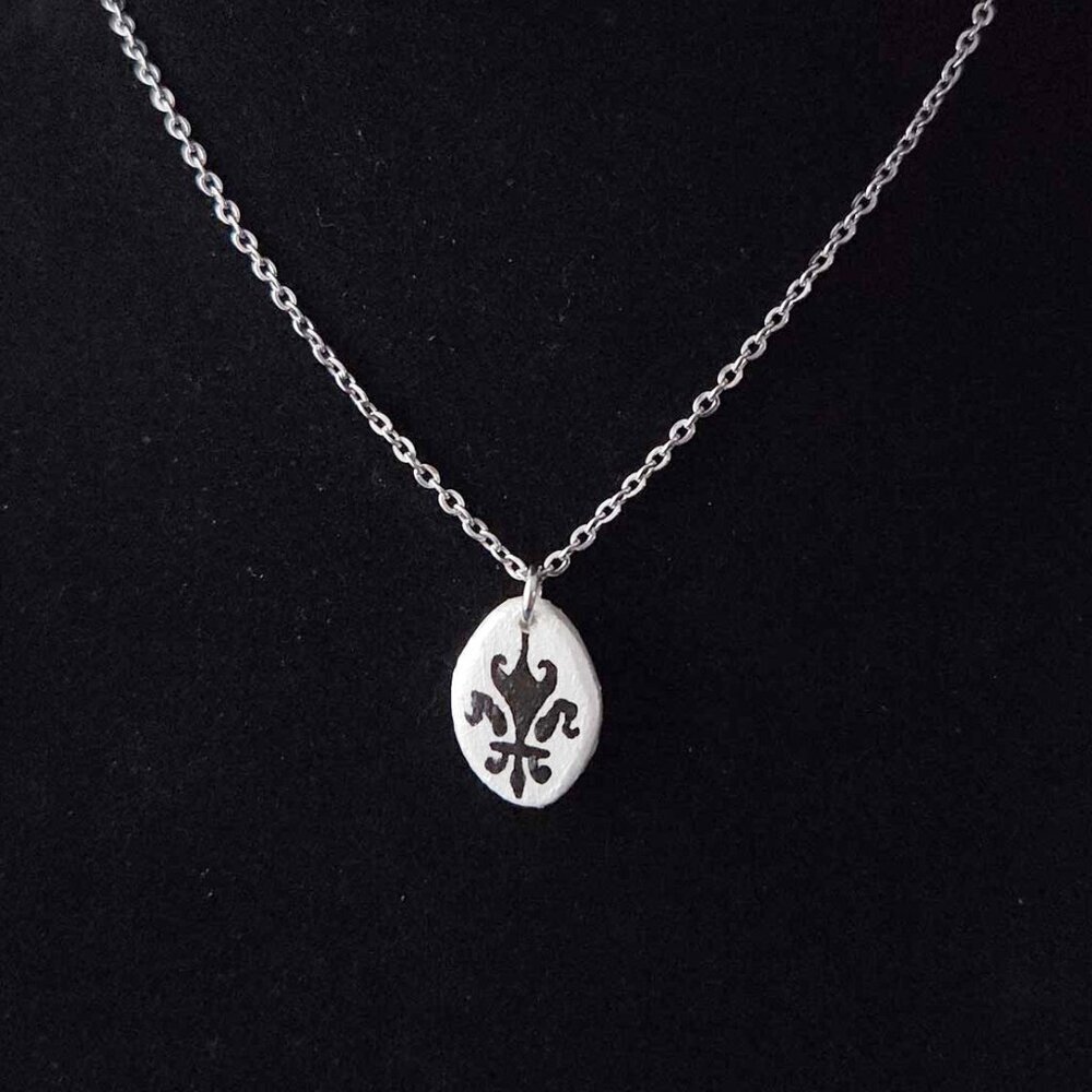 Gothic Fleur de Lys silver iridescent necklace with a small silver chain